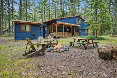 Gather around the fire — Adirondacks, a picnic table, and the whole backyard.