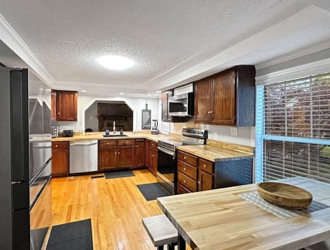 Large fully stocked kitchen with ample dishes, pots and pans, etc. for large groups