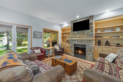 Living Room with fireplace and TV | Main Level