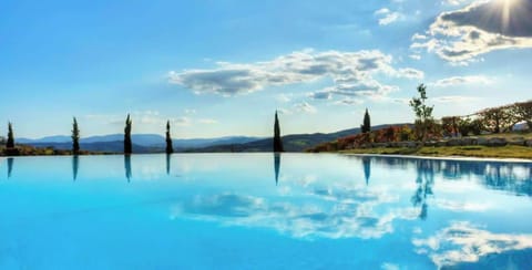 Indoor pool, seasonal outdoor pool, pool umbrellas, sun loungers