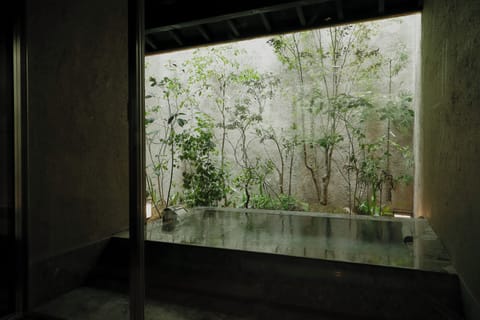 Japanese-style House, Garden View | Bathroom | Combined shower/tub, hair dryer, slippers, towels