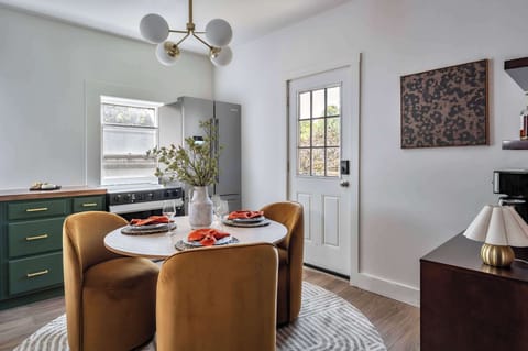 Where every meal feels like a celebration! Our stylish dining nook is perfect for shared stories and delicious feasts, with a fully-equipped kitchen just steps away. 