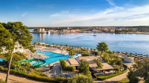 Indoor pool, outdoor pool, pool umbrellas, sun loungers