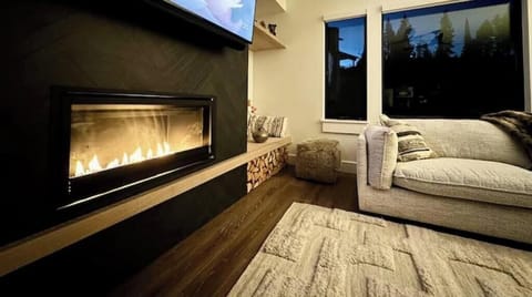 Spacious living room with cozy fireplace.
