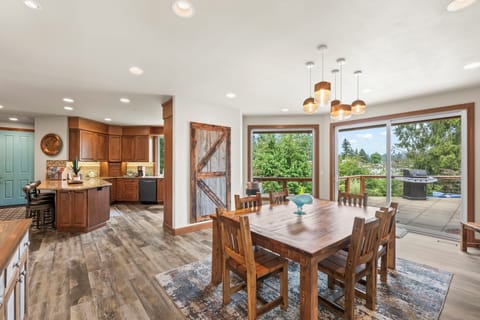 Along with bar seats, the table has extra chairs and easy access to the BBQ!