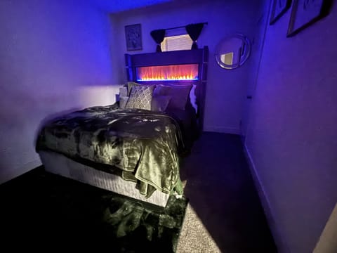 Queen Size bed with cozy fireplace display in the headboard. Smart 42inch TV. 