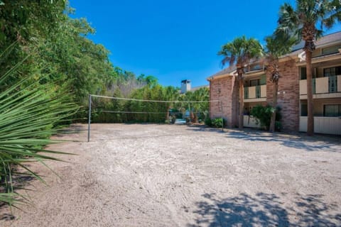 Resort-style amenities including a pool, spa, and volleyball court for your enjoyment.