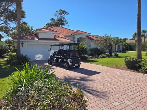 Front of house with golf cart