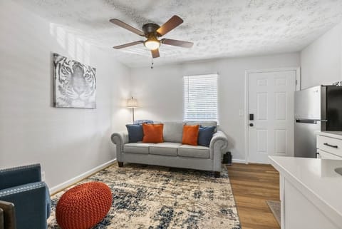 Studio setup with queen bed and sleeper sofa.