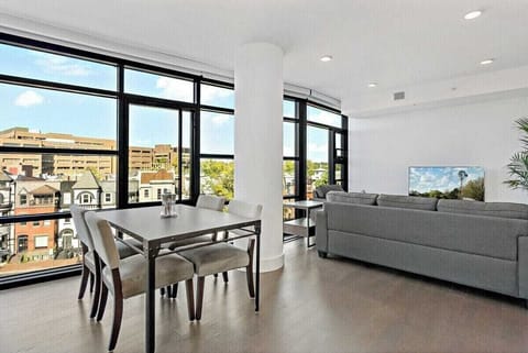 Open plan living and dining with floor to ceiling city views