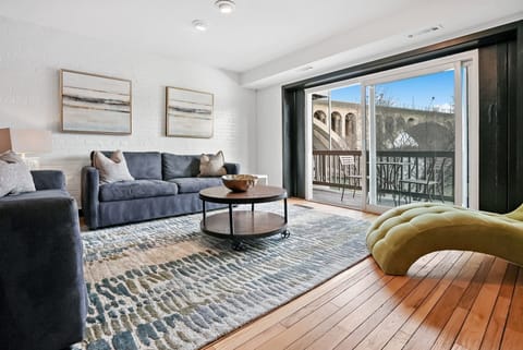 River-view living room with access to the upper deck