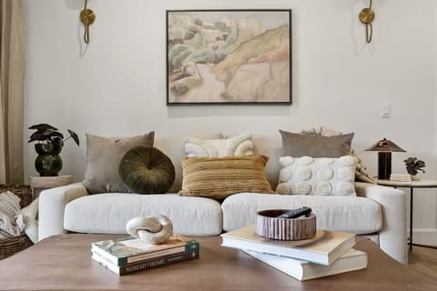 Sink into comfort with curated pillows, soft textures, and cozy reading vibes. Ideal for unwinding after a day of exploring. Bonus: this sofa converts into a comfy sofabed.