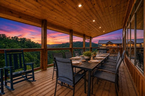 Outdoor dining space on rear deck with stunning views of Wears Valley
