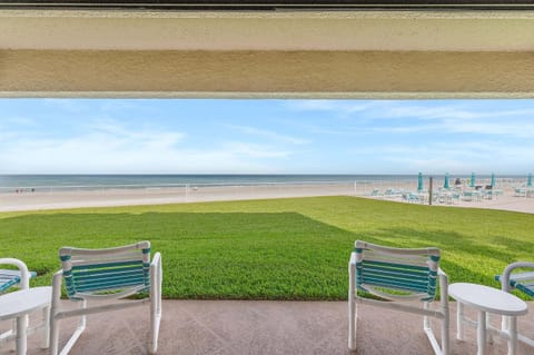 Relax on your private oceanfront patio with comfortable seating, lush green space, and uninterrupted Atlantic views. This beach stay offers easy access to the pool and sandy shoreline, creating the perfect spot to unwind by the ocean.