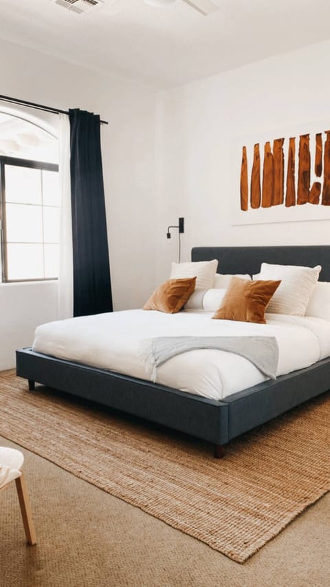 Comfy King bed, blackout curtains for sleeping and sheers for daytime privacy. Original contemporary art.