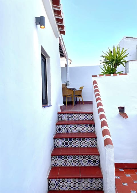 The traditional Spanish steps invite you to the private rooftop terrace. 
