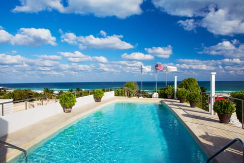 Outdoor pool, open 7:00 AM to 7:00 PM, pool umbrellas, sun loungers