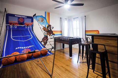Gameroom with basketball arcade, fooseball, bar seating for 4 with 50" Smart TV