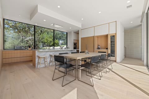 Open concept kitchen and dining area with seating for eight people