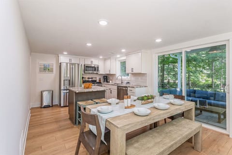 Dining space seats 8-10 and has sliders to the covered patio