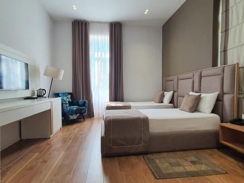 Twin Room, City View | In-room safe, blackout drapes, iron/ironing board, free WiFi