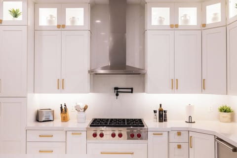 Cook like a pro with a Wolf range and pot filler – gourmet meals made easy.