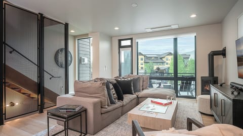 Great Room, Main Level - With fireplace and balcony access