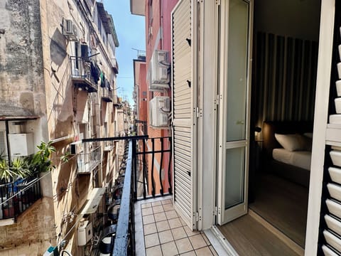 Classic Quadruple Room, City View | Balcony