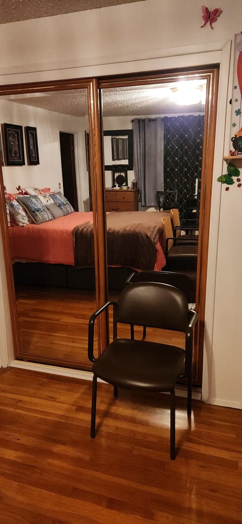 This large closet with long mirror doors will hold all of your belongings. 