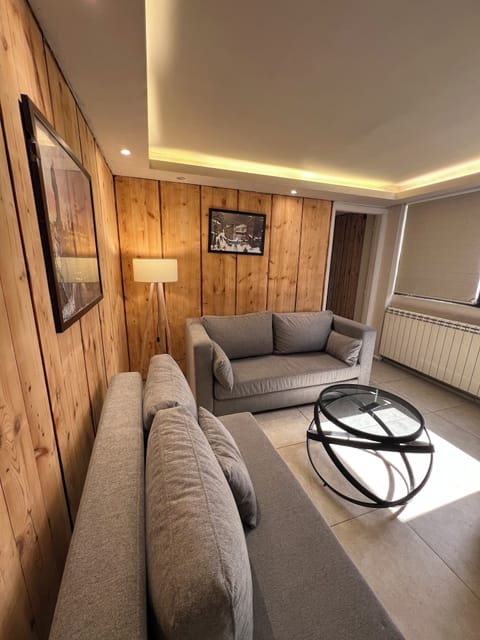 Comfort Chalet, 2 Bedrooms, Mountain View | Living area | Flat-screen TV, fireplace