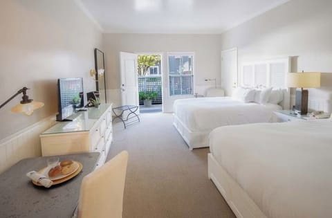 Settle into crisp linens and enjoy a bright, breezy room.