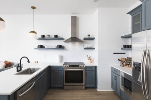 Condo 1 - Fully-stocked kitchen with high-end appliances and all the utensils / dishware you'll need.