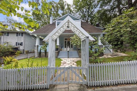 Charming front yard w/ picket fence & pergola entry welcoming you in