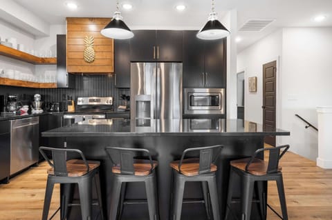 Unit 360’s chic, open kitchen offers ample space & every home comfort​