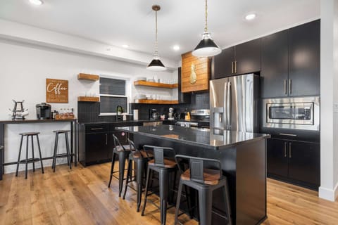 Unit 360’s chic, open kitchen offers ample space & every home comfort​
