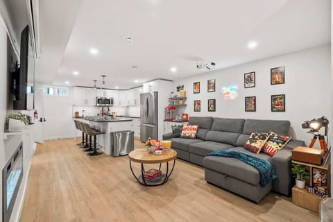 Movie night meets modern comfort. Enjoy a cozy lounge with cinematic charm, a fully stocked kitchen, and plenty of space to relax, snack, and connect.