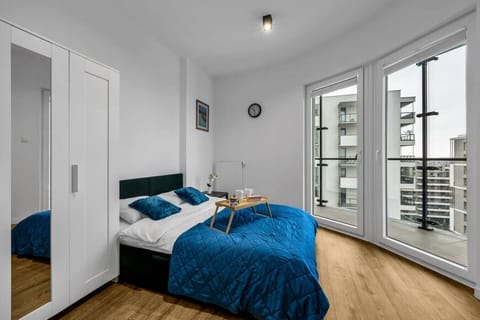 Main Living Area with Queen Bed, Smart TV and Dining Table  |  Book Now with RENTUJEMY.COM