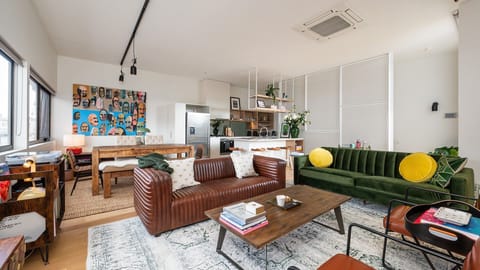 Upstairs living with multiple Tom Gerrard pieces 