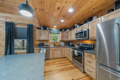 Granite Counters and Stainless Appliances in the Well Equipped Kitchen