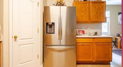 Kitchen area.  Full refrigerator and pantry