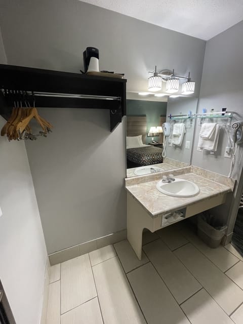 Desk, laptop workspace, blackout drapes, iron/ironing board