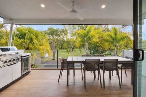 Covered outdoor dining with beautiful tree top views. 