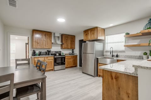 Brand new modern appliances and rustic cabinetry blend comfort and style in this chef-ready space.