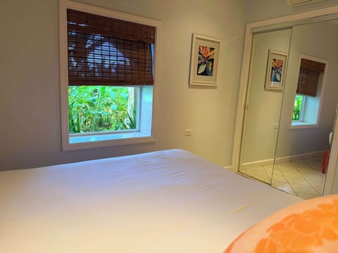 Hibiscus Room with queen bed, comfort of AC, ceiling fan, smart TV, western facing. Kitchenette and private bathroom