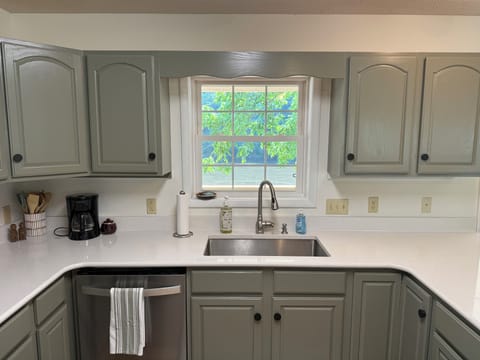 Newly remodeled kitchen with window overlooking the river.