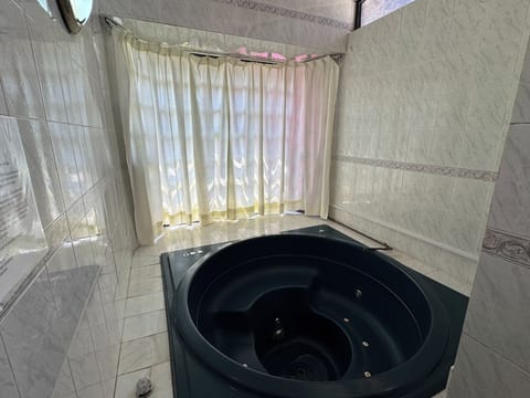 Senior Studio Suite | Bathroom | Shower, towels, soap, shampoo