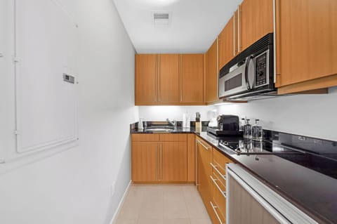 Superior Studio Suite, Partial Ocean View | Private kitchen | Mini-fridge, microwave, stovetop, dishwasher