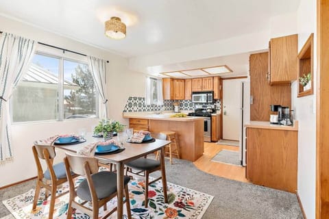 The fully equipped kitchen and dining area is a great place to make any meal, or grab your morning coffee. 