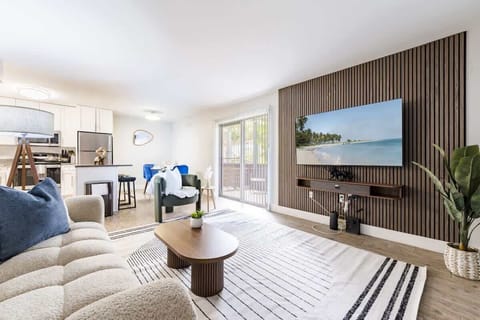 A refined open-plan layout featuring designer finishes, custom details, and a serene, contemporary vibe. An effortless flow between living, dining and kitchen