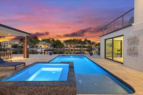 Poolside escape with heated spa crystal water and glow of a perfect evening
